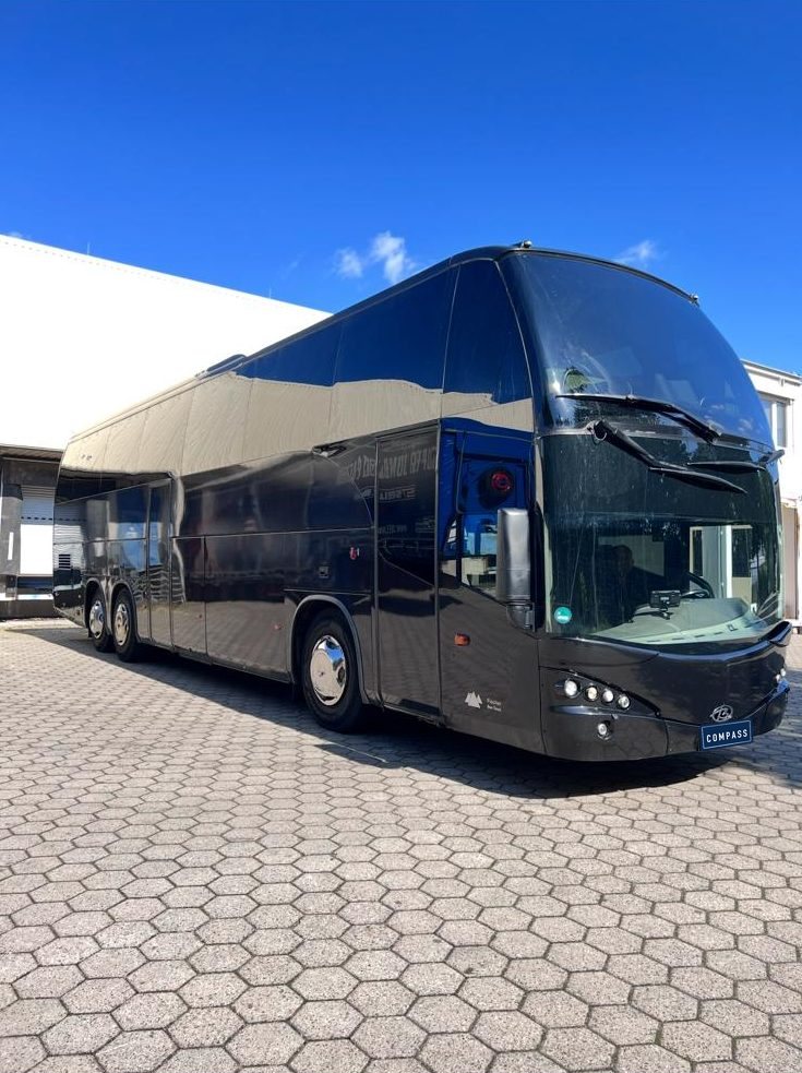 Black three-axle coach